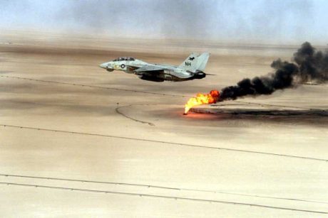 F-15 flying over a burning oil field in Kuwait