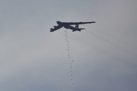 A U.S. Air Force B-52H Stratofortress drops Guided Bomb Unit-38's during a combined live fire demonstration during Exercise Eager Lion in Wadi Shadiya, Jordan, May 18, 2015. Eager Lion is a recurring, multinational exercise designed to strengthen military-to-military relationships, increase interoperability between partner nations, and enhance regional security and stability. (U.S. Marine Corps photo by Cpl. Sean Searfus CE MARFOR CENTCOM FWD COMCAM/ Released)