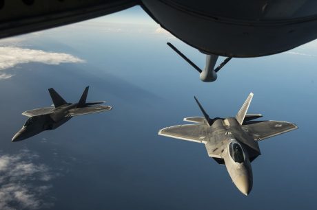 Two U.S. Air Force F-22 Raptors from the 95th Fighter Squadron, Tyndall Air Force Base, Fla., fly behind a KC-135 Stratotanker from the 100th Air Refueling Wing, RAF Mildenhall Air Base, England Sept. 4, 2015, over the Baltic Sea. The U.S. Air Force has deployed four F-22 Raptors, one C-17 Globemaster III, approximately 60 Airmen and associated equipment to Spangdahlem Air Base, Germany. While these aircraft and Airmen are in Europe, they will conduct air training with other Europe-based aircraft. (U.S. Air Force photo by Tech. Sgt. Jason Robertson/Released)