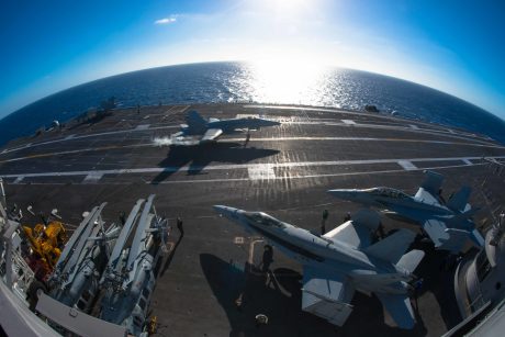 151023-N-XX566-098 PACIFIC OCEAN (Oct. 23, 2015) - An F/A-18C Hornet assigned to the Sharpshooters of Marine Fighter Attack Training Squadron (VMFAT) 101 catches an arresting gear cable as it lands onto USS John C. Stennis' (CVN 74) flight deck. Stennis' crew is currently conducting fleet replacement squadron carrier qualifications. (U.S. Navy photo by Mass Communication Specialist 3rd Class Andre T. Richard Released)