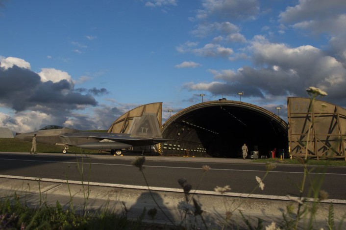 An F-22 Raptor fighter aircraft assigned to the 95th Fighter Squadron at Tyndall Air Force Base, Fla., sits outside a hardened aircraft shelter at Spangdahlem Air Base, Germany, Aug. 28, 2015. The U.S. Air Force deployed four F-22 Raptors, one C-17 Globemaster III and more than 50 Airmen to Spangdahlem in support of the first F-22 European training deployment. The inaugural F-22 training deployment to Europe is funded by the European Reassurance Initiative, a $1 billion pledge announced by President Obama in March 2014. (U.S. Air Force photo by Airman 1st Class Luke Kitterman/Released)