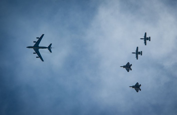 A KC-135 Stratotanker along with two F-22 Raptors and two A-10 Thunderbolt IIs fly overhead before landing at Ämari Air Base, Estonia, Sept. 4, 2015, as part of a brief forward deployment. The F-22s have previously deployed to both the Pacific and Southwest Asia for Airmen to train in a realistic environment while testing partner nations' ability to host advanced aircraft like the F-22. The F-22s are deployed from the 95th Fighter Squadron at Tyndall Air Force Base, Florida. The U.S. Air Force routinely deploys aircraft and Airmen to Europe for training and exercises. (U.S. Air Force photo/ Tech. Sgt. Ryan Crane)