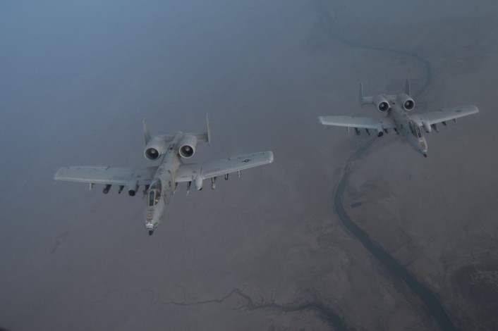 A pair U.S. Air Force A-10 Warthogs, assigned to the 163rd Expeditionary Fighter Squadron, wait to receive fuel from a KC-135 Stratotanker, 340th Expeditionary Aerial Refueling Squadron, over Southwest Asia, Oct. 13, 2015. Coalition forces fly daily missions in support of Operation Inherent Resolve. (U.S. Air Force photo by Senior Airman Taylor Queen/Released)
