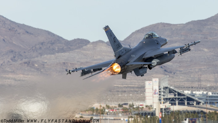 F-16C of the AATC (Tucson, AZ) in a guest appearance launches from Nellis AFb on Red Flag 16-1 sortie.