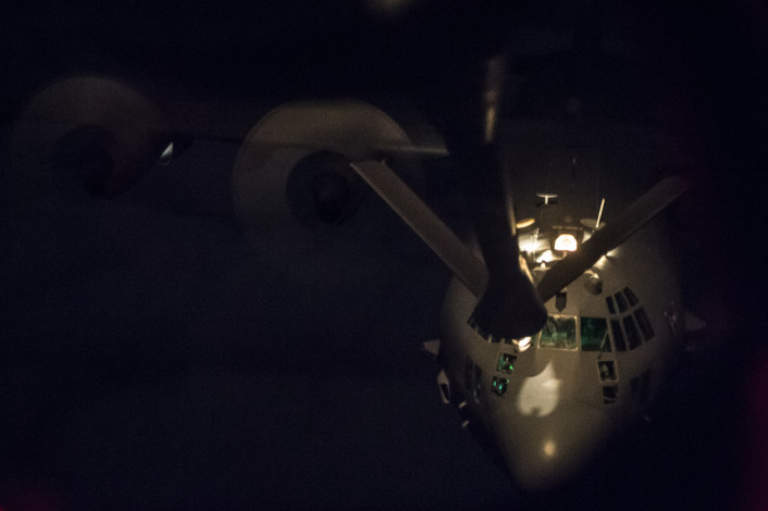 A U.S. Air Force AC-130 Gunship approaches a USAF KC-135 Stratotanker over Iraq, March 29, 2016. The United States stands with a coalition of more than 60 international partners to assist and support the Iraqi Security Forces to degrade and defeat ISIL. (U.S. Air Force photo by Staff Sgt. Corey Hook/Released)
