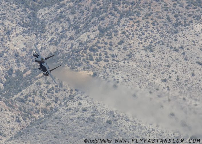 F-15E of the 4th FW and 336 FS of Seymour Johnson AFB climbing to crest N. Groom range on ingress to the NTTR during Red Flag 16-2.