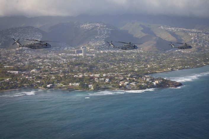 U.S. Marine CH-53E Super Stallion helicopters assigned to Marine Heavy Helicopter Squadron 463, fly in formation off the coast of Oahu, Hawaii, April 29th, 2016, after interoperability operations with the 25th Infantry Division's 25th Combat Aviation Brigade.  (U.S. Marine Corps photo by Capt. Tim Irish)