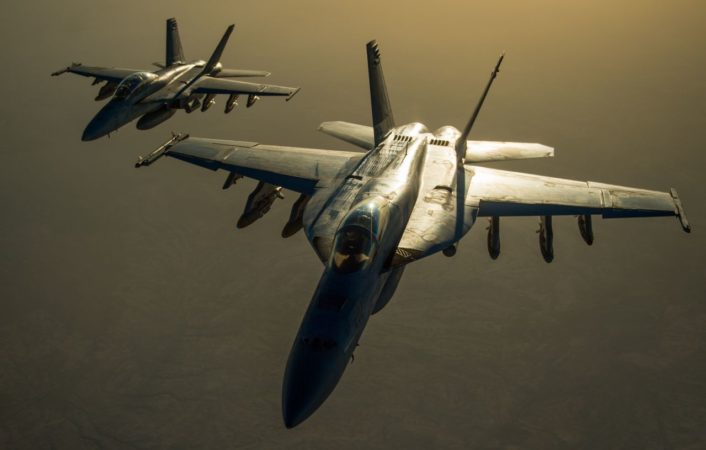 Two U.S. Navy F/A-18 Super Hornet fly in formation after receiving fuel from a KC-135 Stratotanker over Iraq in support of Operation Inherent Resolve Oct 17, 2016. The KC-135 provides the core aerial refueling capability for the U.S. Air Force and has excelled in this role for more than 50 years. (U.S. Air Force photo by Staff Sgt. Douglas Ellis/Released)