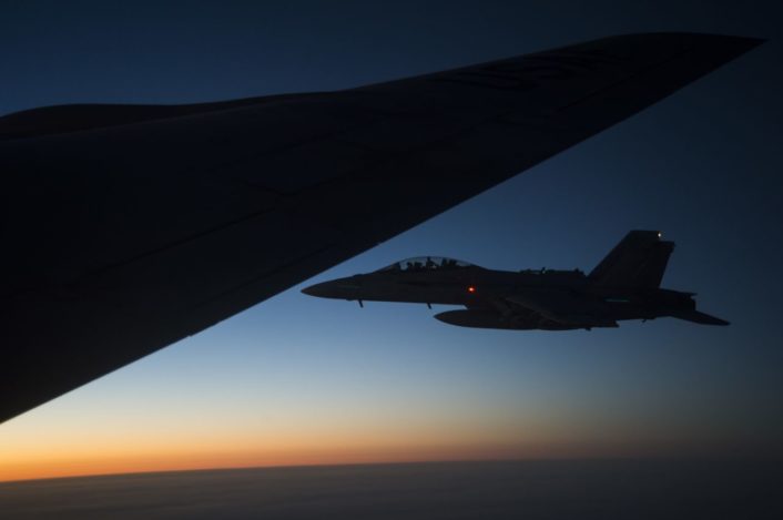 A U.S. Navy F/A-18 Super Hornet flies off the wing of a KC-135 Stratotanker over Iraq after refuel Sept. 28, 2016. Airmen from the 340th Expeditionary Air Refueling Squadron refueled U.S. Navy F/A-18 Super Hornets over Iraq in support of Combined Joint Task Force-Operation Inherent Resolve. The U.S. and more than 60 coalition partners work together to eliminate Daesh and the threat they pose to Iraq and Syria. (U.S. Air Force photo/Tech. Sgt. Larry E. Reid Jr., Released)