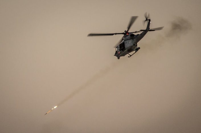 A U.S. Marine Corps UH-1Y Venom assigned to Marine Aviation Weapons and Tactics Squadron One (MAWTS-1) engages targets during an urban close air support exercise at Yodaville, Yuma, Ariz., Sept. 30, 2016. The urban close air support exercise was part of Weapons and Tactics Instructor Course (WTI) 1-17, a seven-week training event, hosted by MAWTS-1 cadre, which emphasizes operational integration of the six functions of Marine Corps aviation in support of a Marine Air Ground Task Force. MAWTS-1 provides standardized advanced tactical training and certification of unit instructor qualifications to support Marine Aviation Training and Readiness and assists in developing and employing aviation weapons and tactics. (U.S. Marine Corps photo by Lance Cpl. Danny Gonzalez 1st MARDIV COMCAM)