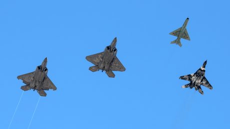 MiG-29, MiG-21, and Two F-22s Carry Out Memorial Flyover For Col. (Ret.) Gail Peck At Nellis AFB