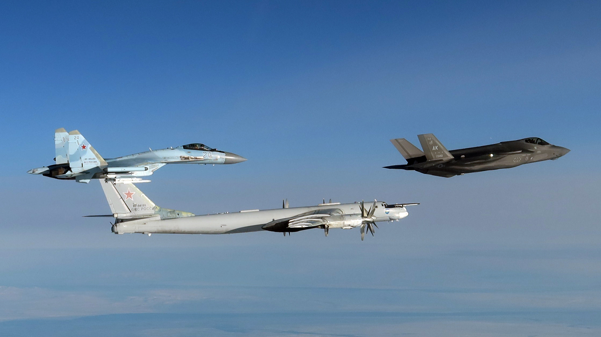 NORAD Releases Photos of U.S. F-35s Intercepting Russian Tu-95s and Armed Su-35s Off Alaska